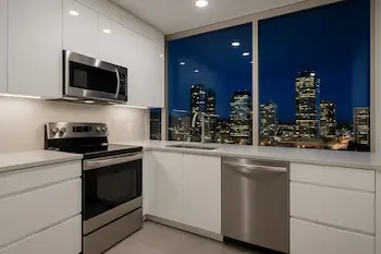 Modern condo kitchen cabinet makeover in downtown Bellevue with sleek contemporary finish