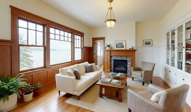 Beautiful craftsman interior living room in an Edmonds Washington home with freshly painted warm white walls, original fir woodwork and natural sound light