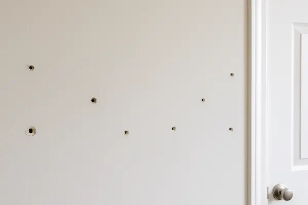 Multiple small holes repaired in Everett living room