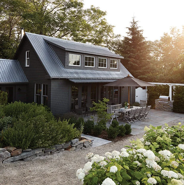 Modern Seattle home exterior in dark charcoal with white trim — Iron Ore SW 7069 example