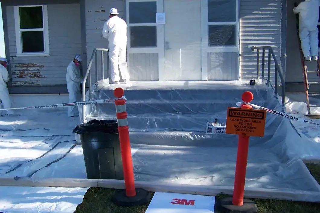 Lead-safe plastic containment setup inside Seattle home before painting — EPA RRP process